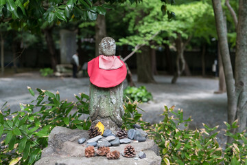 Stone Buddha statue at Kamakura Daibutsu great Buddha garden