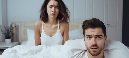Fototapeta premium Upset young couple having problems with sex In bed depressed and frustrated about relationships, The family has problems in sexual life impotence concept