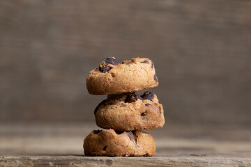 Fototapeta na wymiar Brown cookies on wooden background