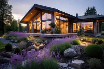 Deurstickers Tuin Modern house with lavender garden at sunset. House construction project