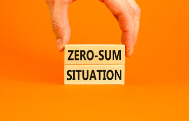 Zero-sum situation symbol. Concept words Zero-sum situation on beautiful wooden blocks. Beautiful orange background. Businessman hand. Business psychology zero-sum situation concept. Copy space.
