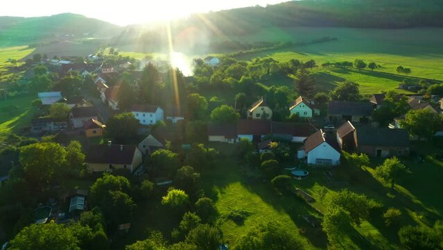 A village in the middle of the woods. Sunset over rural landscape.  The Šumava Hills on the Czech-German border. Central Europe.