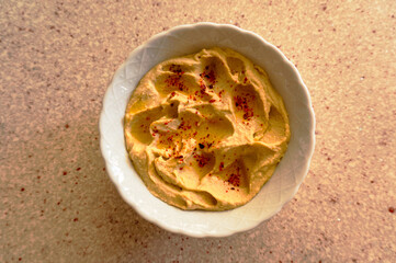 Homemade chickpea hummus, olive oil, chili flakes.