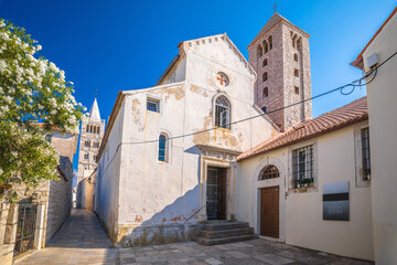 Fototapeta na wymiar Town of Rab scenic stone street and church towers view, island of Rab