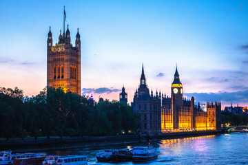 Palace of Westminster and Big Ben sundown view from Thames river