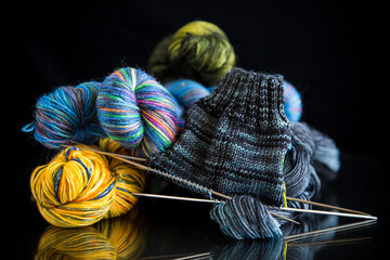 Colored threads, knitting needles and other items for hand knitting