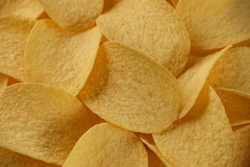 Gold potato chips close up