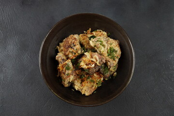 Fried beef liver with fried onions and herbs