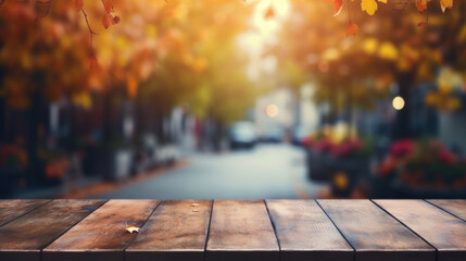 Naklejka na ściany i meble Empty wooden table top with blur background of city street in autumn