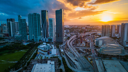 Aerial Establishing Shot of Skyscrapers and Highway in Miami City Downtown USA, American City...