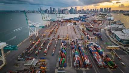 Foto auf Alu-Dibond Vereinigte Staaten Aerial at sunset of Miami Downtown skyline with port and crane logistic container cargo boat 