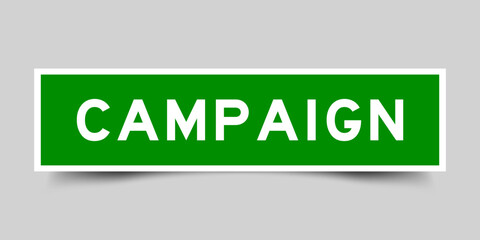 Green color square label sticker with word campaign on gray background