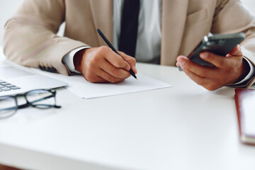 Manager man write plan businessman desk hands pen document suit business