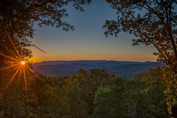 Striking Sunset Just Above Distant Mountains
