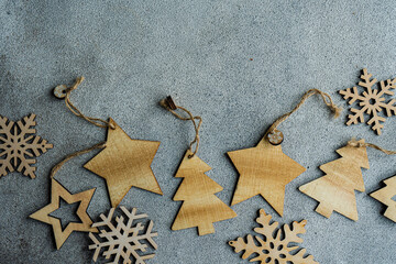 Fototapeta na wymiar Christmas frame made with wooden decorations