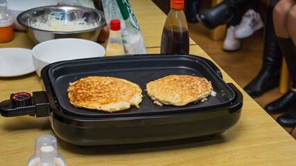 Cooking a Japanese dish.  A Japanese restaurant in Khabarovsk in the Russian Far East.