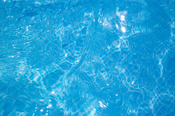 Naklejka premium pool water ripples with sunlight glittery reflections