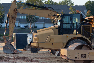 heavy-duty construction vehicles in a residential neighborhood, closeup of cab areas