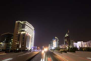 Fototapeta na wymiar Astana, Kazakhstan - September 5, 2016: Night city traffic Kunaev Avenue