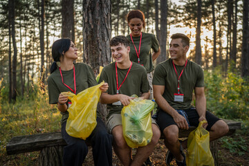 portrait of group of friends volunteers prepare to collect garbage waste and clean forest nature in summer day slow motion © Miljan Živković