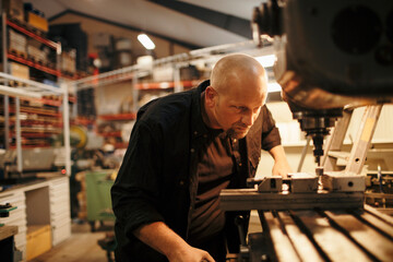 Middle aged man working in a factory