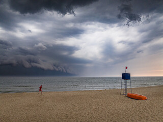Running rescuer to lifeguard tower during storm at Baltic Sea