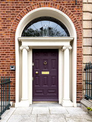 Fototapeta na wymiar A famous purple painted Georgian door in Dublin, Ireland