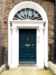 Fototapeta na wymiar A famous dark green painted Georgian door in Dublin, Ireland