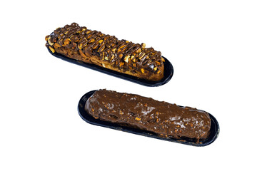 Traditional french dessert. Isolated eclair with custard and chocolate icing and peanuts on white...