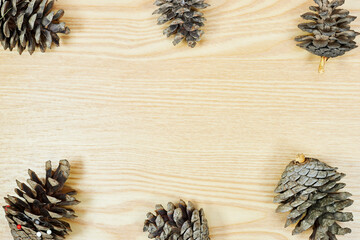 pine cones with copy space for your text on wood table