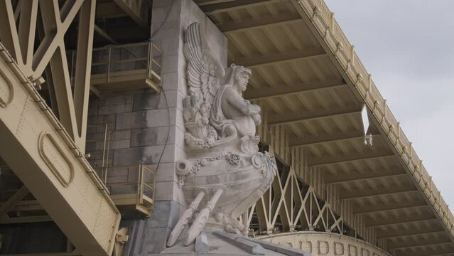 Stone statue on Margaret Bridge in Budapest, Hungary. 