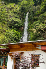 Scenic view of a waterfall behind a cafe in Bhutan.