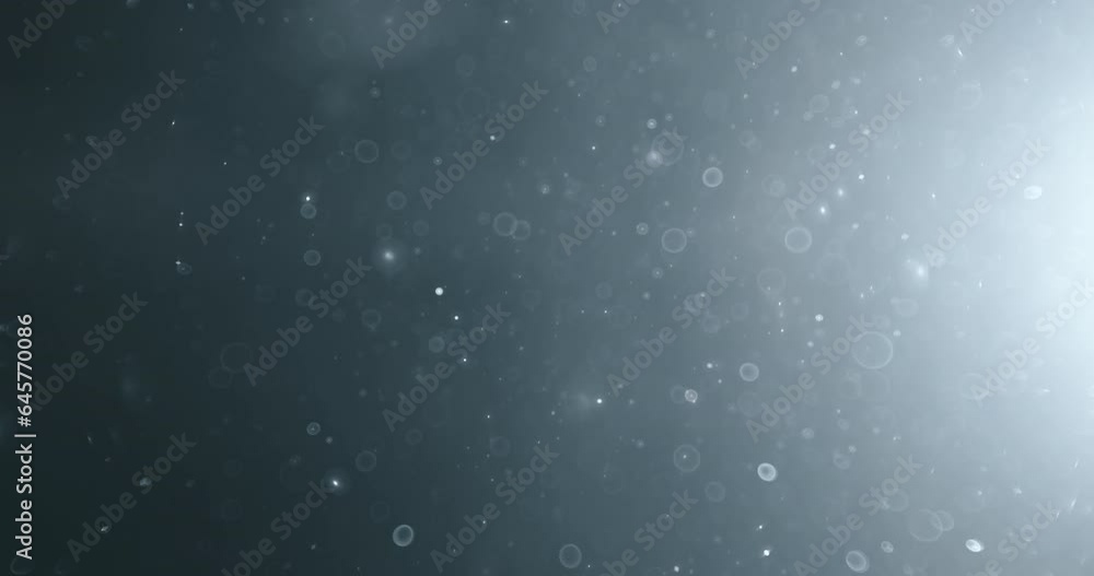 Wall mural floating abstract particle bokeh on dark background