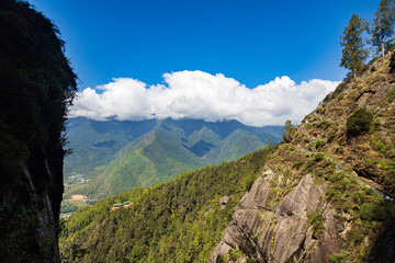 Beautiful view of a valley with trees and mountains in Bhutan, scenic panorama mountain summer landscape