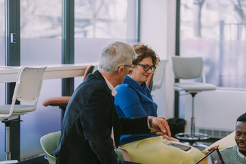 Older business colleagues talking