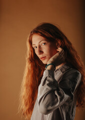 Ginger girl posing in the studio