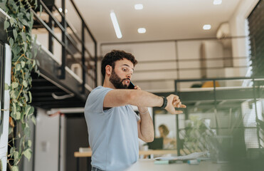 Businessman calling an employee after he is late at the office.