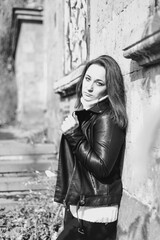 Obraz premium Black and white portrait of a woman in an abandoned park. Girl on a walk.