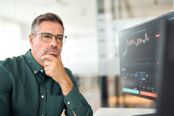 Serious middle aged busy business man crypto broker, financial investor, stock trader expert...