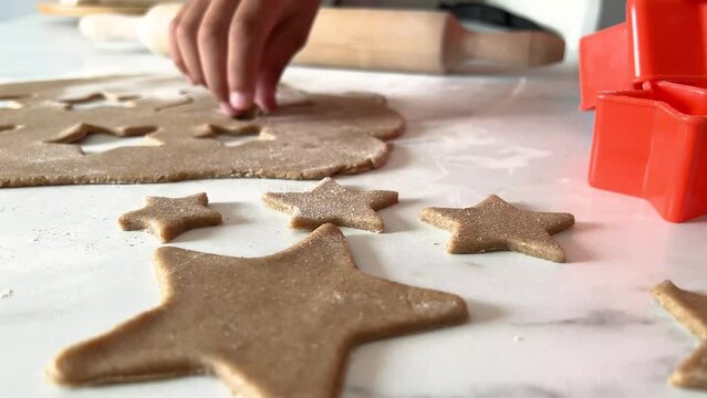 Hands of little child with cookies in shape of star.Christmas mood . close-up