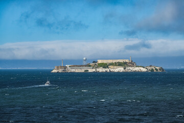 Alcatraz Island in San Francisco Bay seen from ship during Harbor Cruise from SFO tourist landmark...