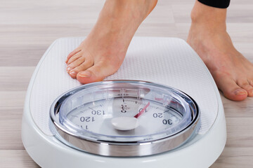 Person Standing On Weighing Scale