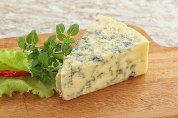 Blue cheese piece over board