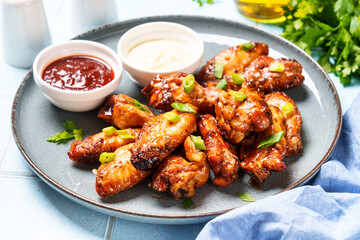 Chicken wings in bbq sauce grilled . Restaurant dish, meat griill.