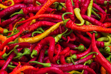 Hot vegetables. Hot peppers on the market counter for sale.