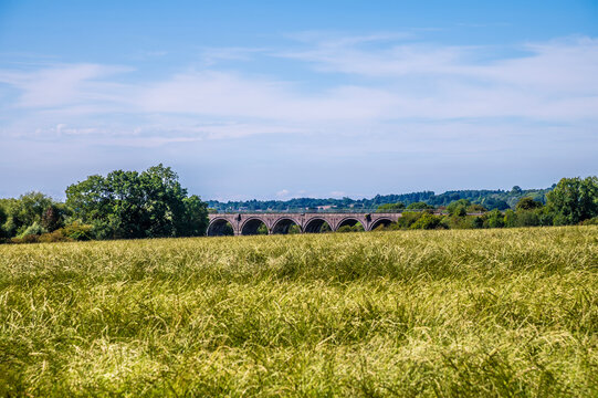 A view across the fields towards the Souldern viaduct in Oxfordshire, UK in summertime