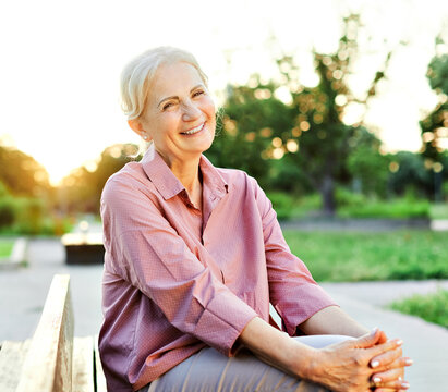 woman outdoor senior happy retirement elderly portrait female active park smiling old fun nature happiness mature lifestyle beautiful bench