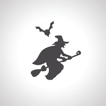 silhouette of a witch flying on a broom with bat
