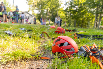 Helmets and equipment for the rope park against the background of people