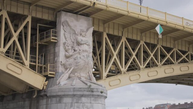Stone statue on Margaret Bridge in Budapest, Hungary. 
